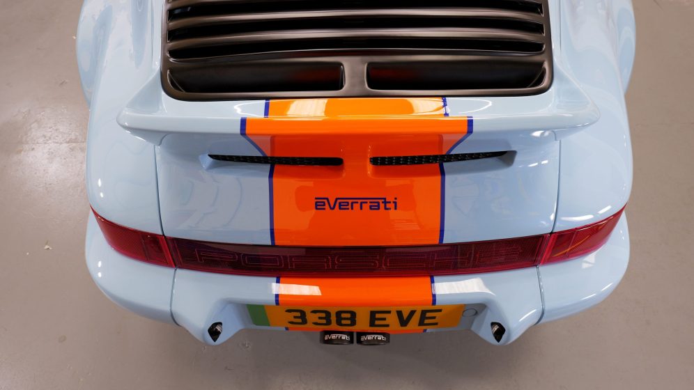 Overhead view of a pale blue Everrati Porsche with an orange centre stripe